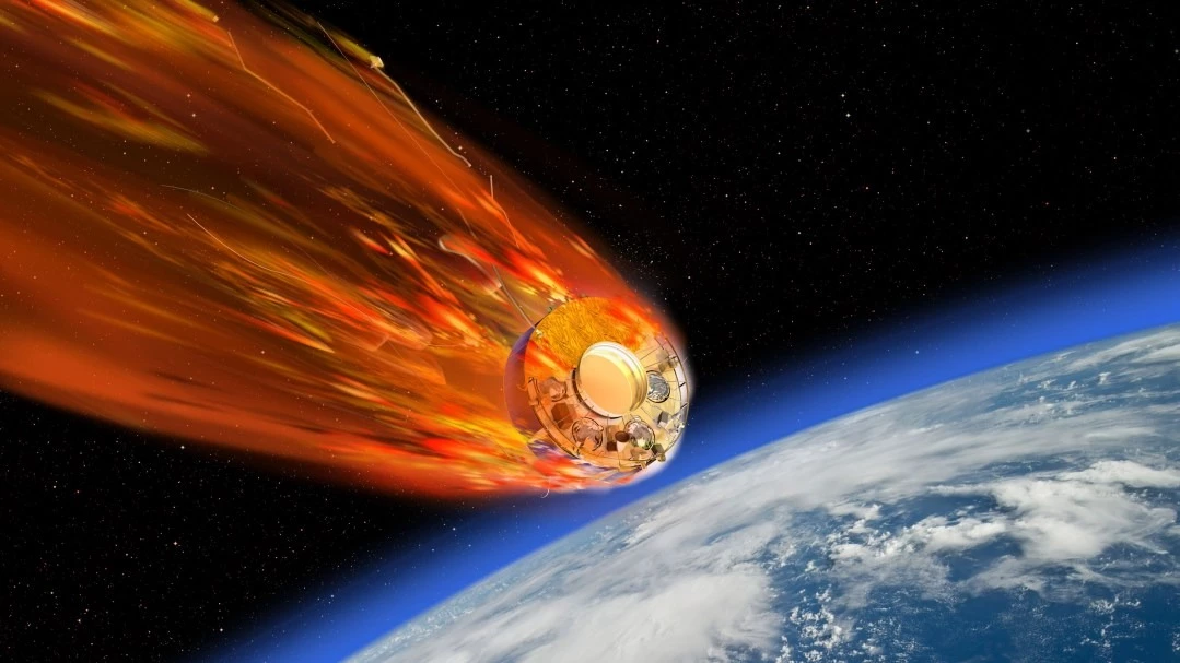 Umělcův koncept družice vstupující do zemské atmosféry